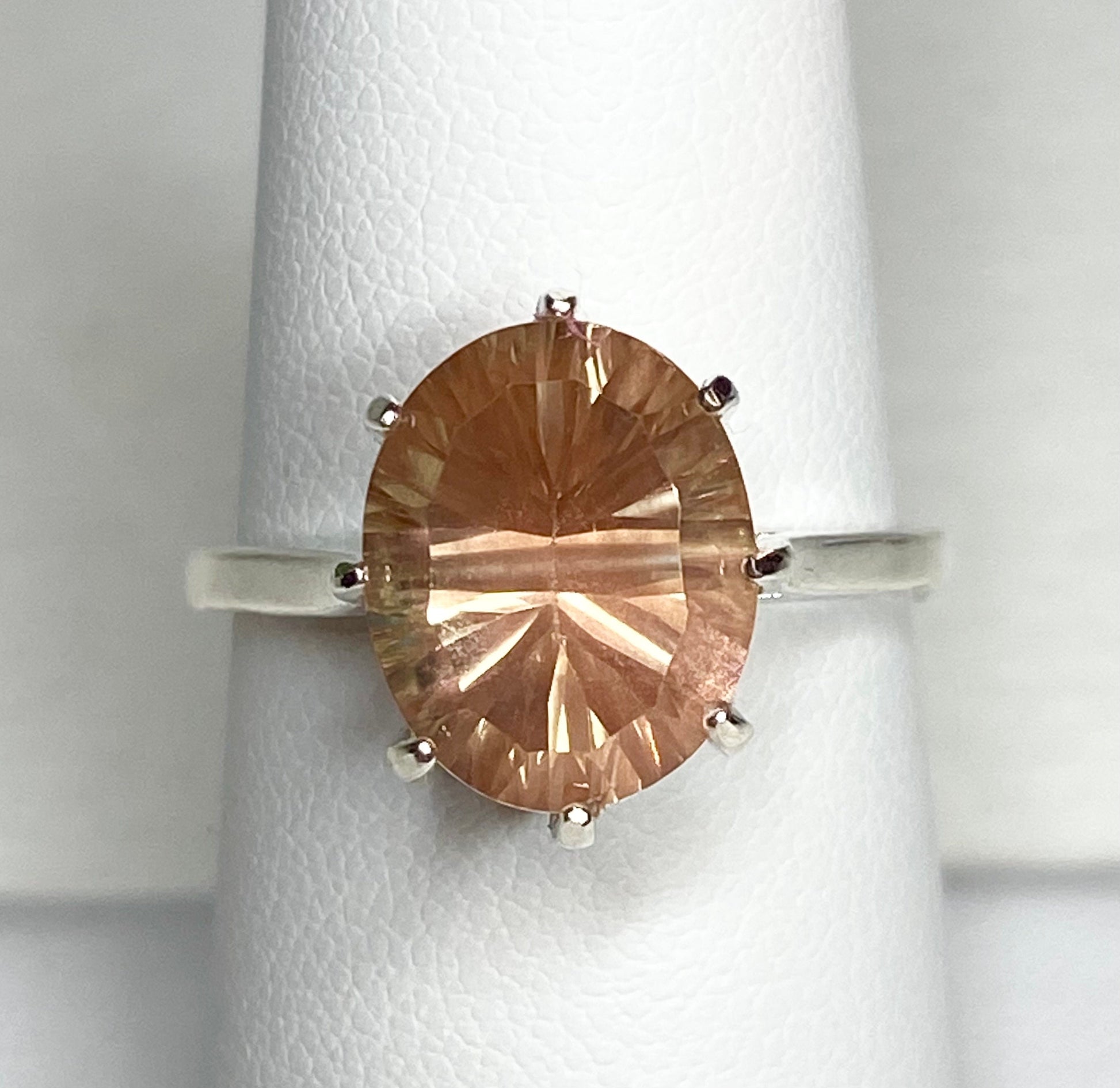 Sterling silver ring with a fancy cut oval Oregon sunstone.