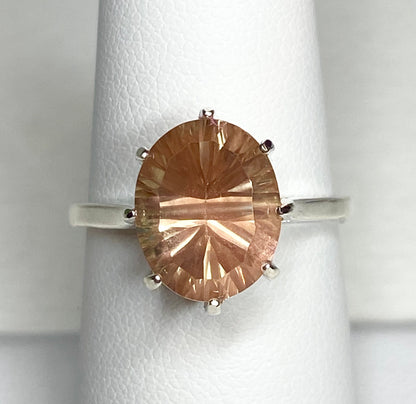 Sterling silver ring with a fancy cut oval Oregon sunstone.