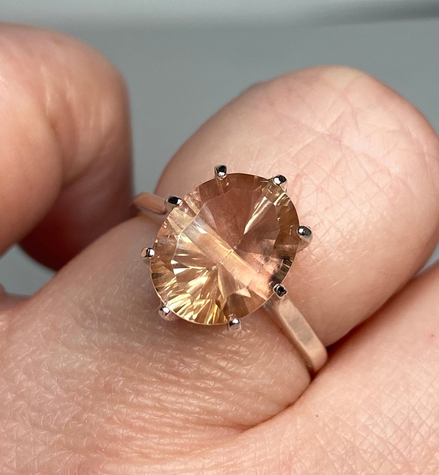 Sterling silver ring with a fancy cut oval Oregon sunstone.
