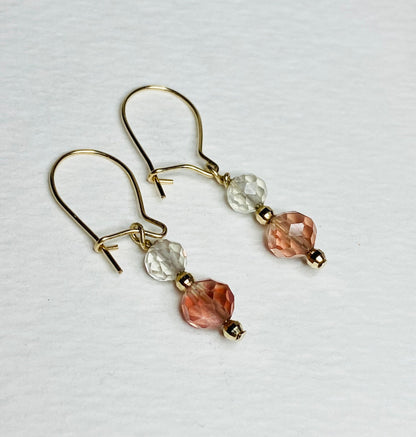 Solid 14k gold dangle earrings with faceted Oregon Sunstone beads.