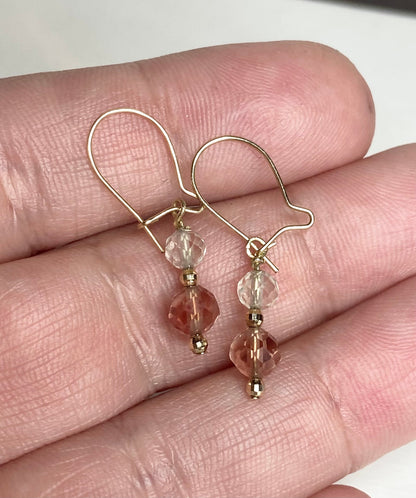 Solid 14k gold dangle earrings with faceted Oregon Sunstone beads.