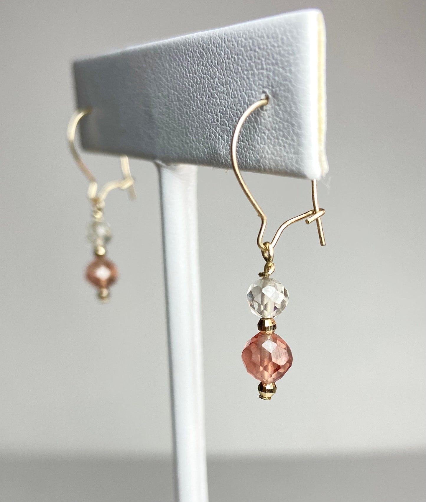 Solid 14k gold dangle earrings with faceted Oregon Sunstone and clear quartz beads.