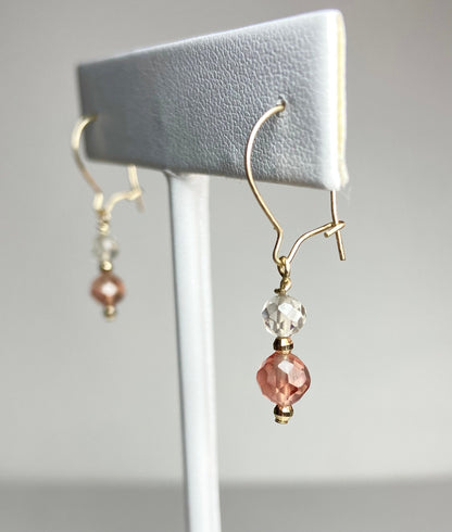 Solid 14k gold dangle earrings with faceted Oregon Sunstone and clear quartz beads.