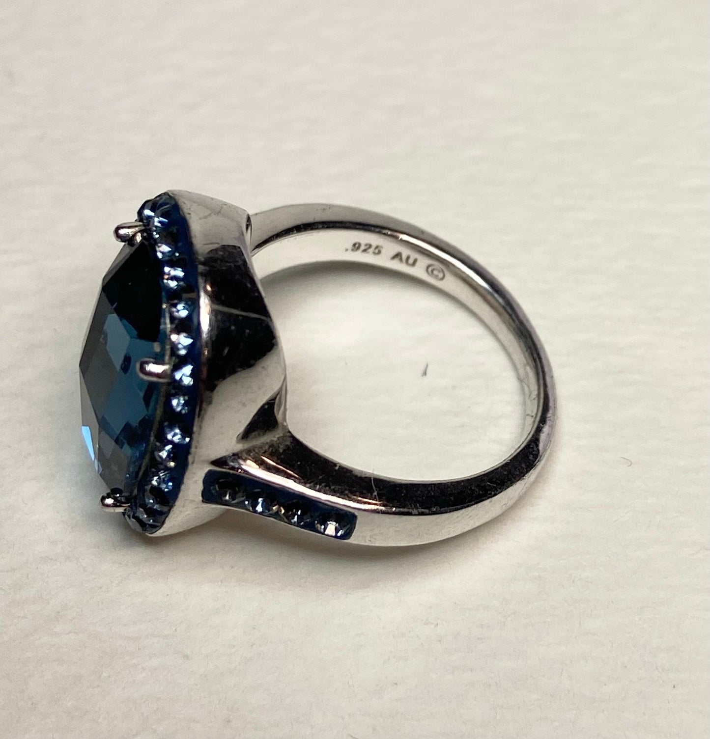 Sterling silver ring with a large Montana blue Swarovski crystal and a halo of smaller blue crystals.