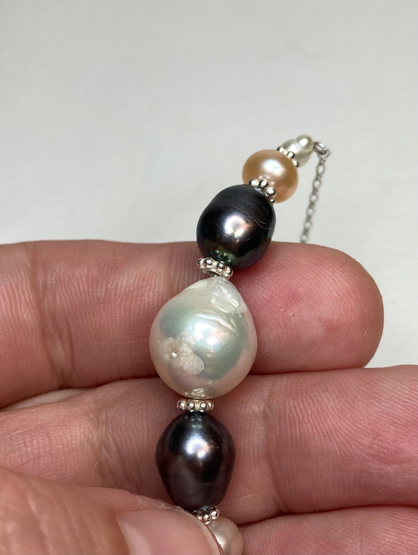 Freshwater pearl multi-colored sterling silver beaded station necklace.