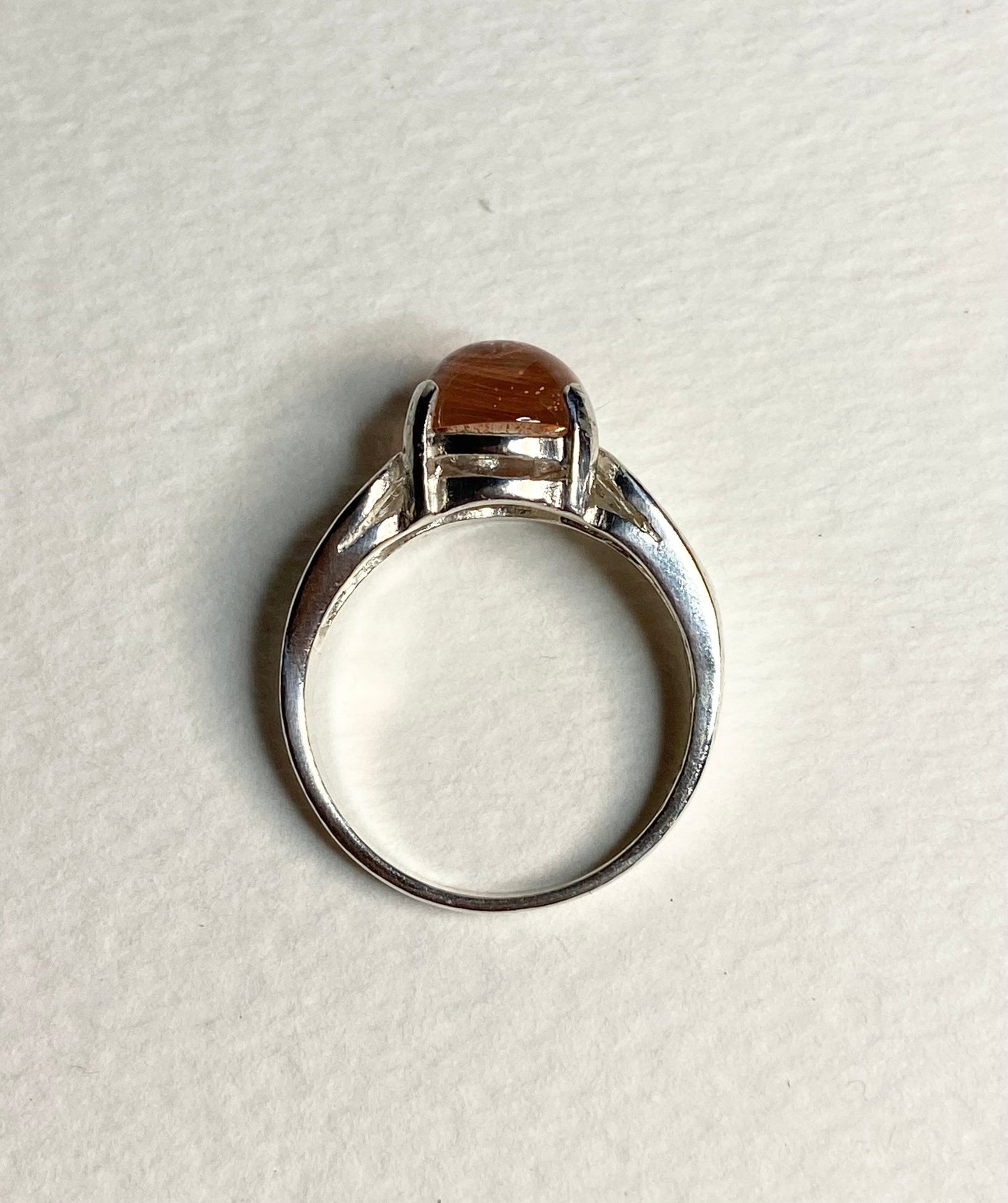 Sterling silver ring with a round Oregon Sunstone cabochon.