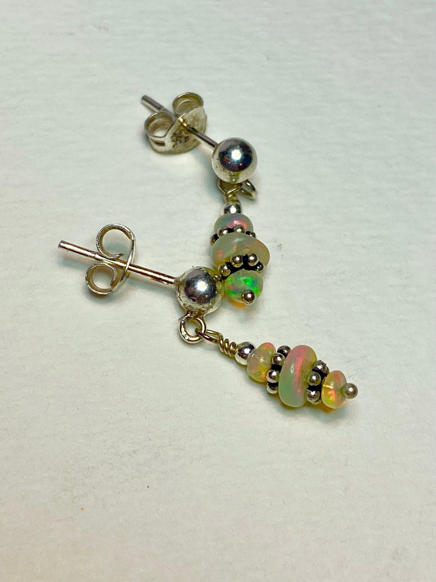 Sterling silver dangle earrings with Ethiopian Wello opals.