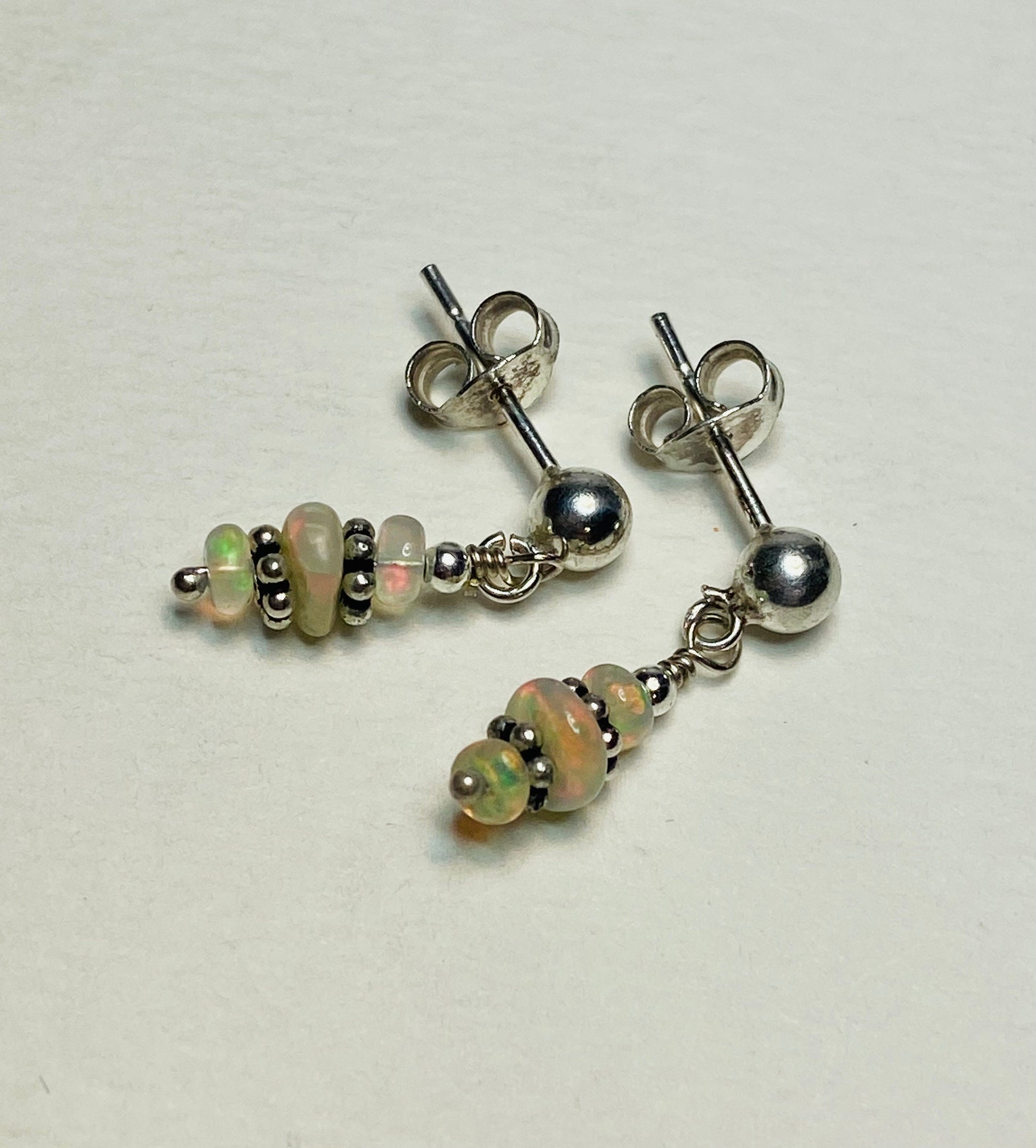 Sterling silver dangle earrings with Ethiopian Wello opals.