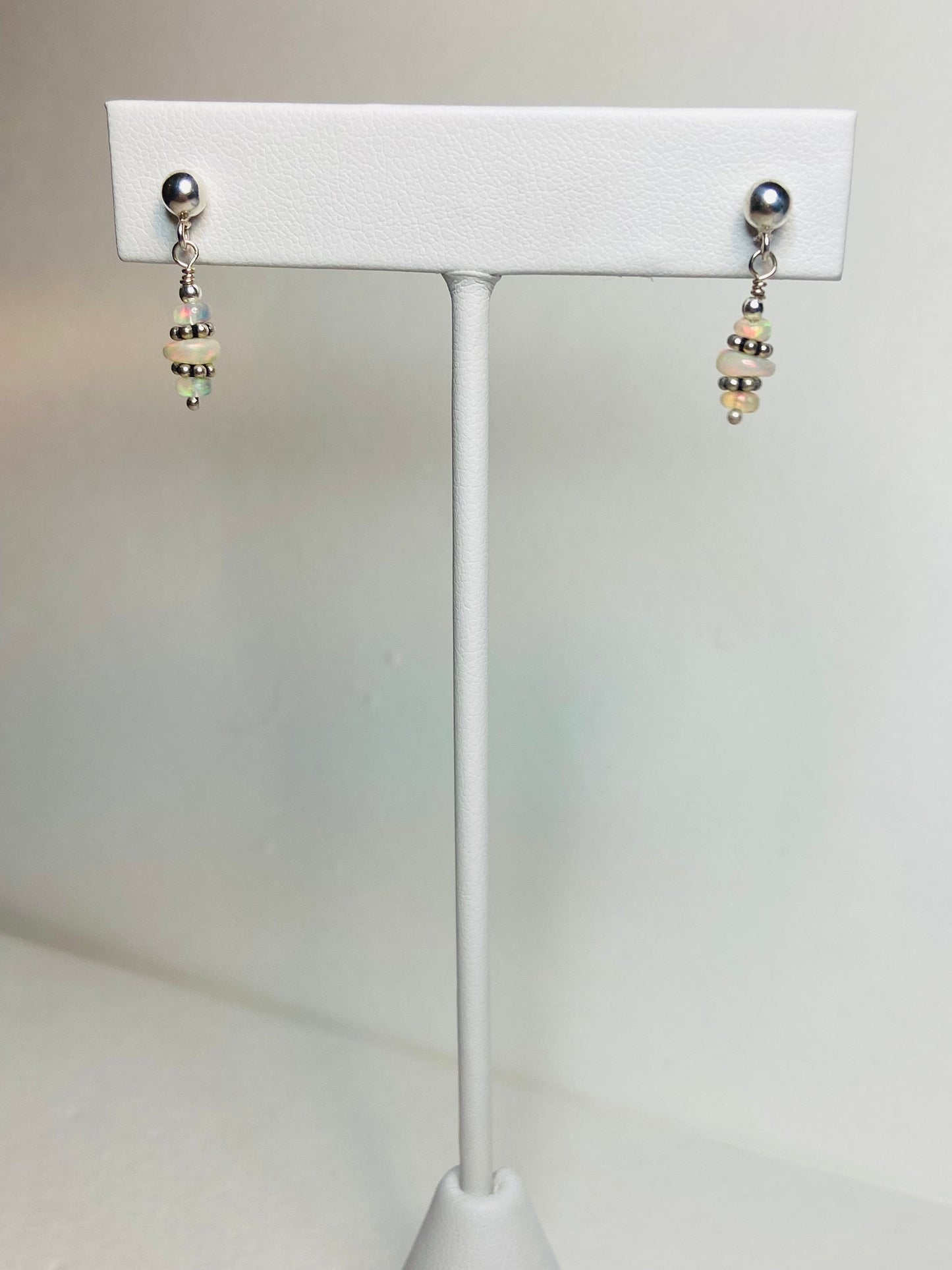 Sterling silver dangle earrings with natural Ethiopian Wello opals.
