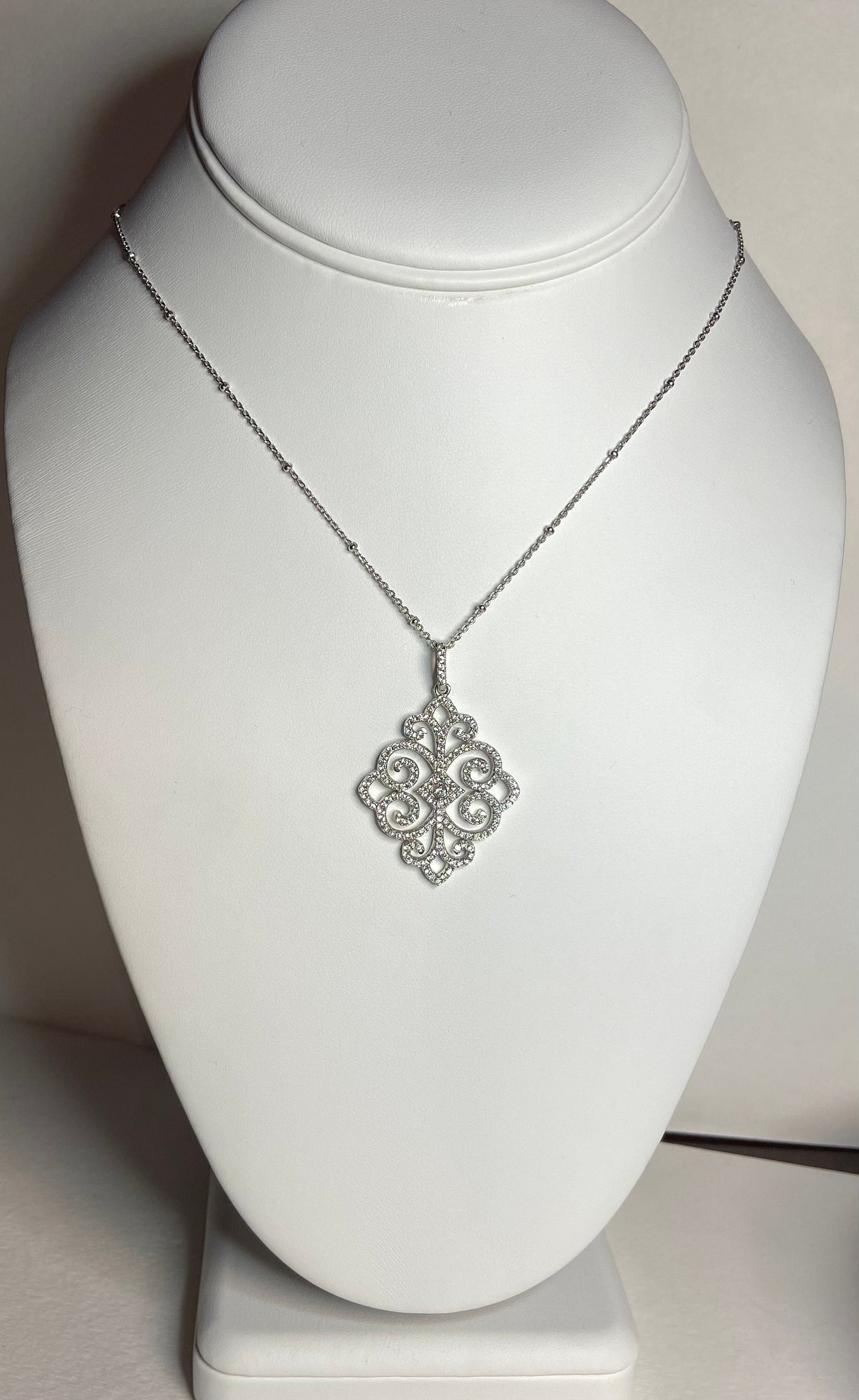 Beautiful pave swirl pendant necklace rhodium over solid sterling silver.