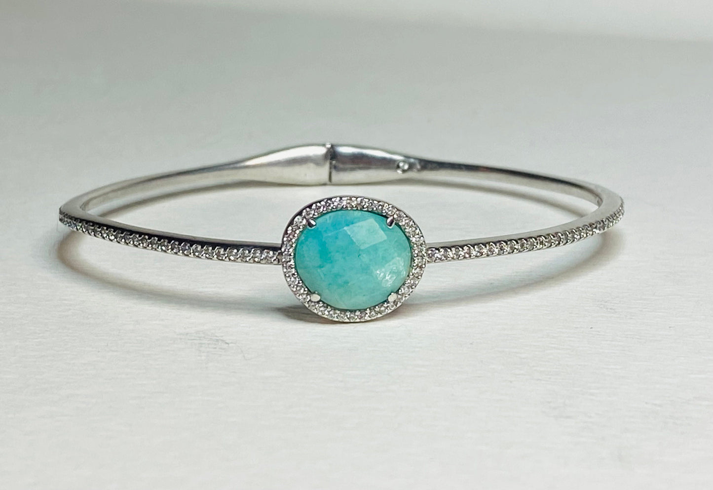Nadri sterling silver hinged bangle bracelet with a faceted amazonite stone and simulated diamonds.