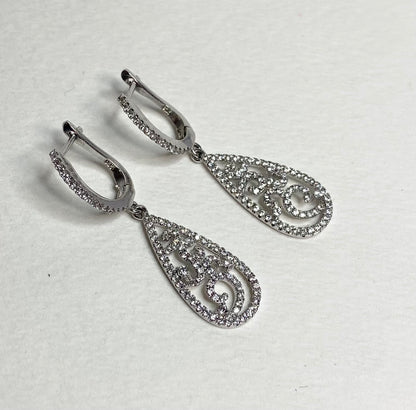 Sterling silver dangle earrings with pave cz stones in a tear shape.