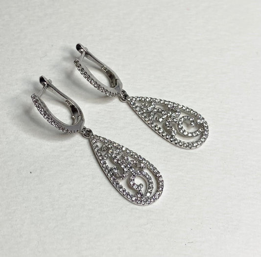 Sterling silver dangle earrings with pave cz stones in a tear shape.