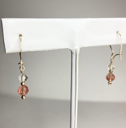 Solid 14k gold dangle earrings with clear and pink faceted beads.