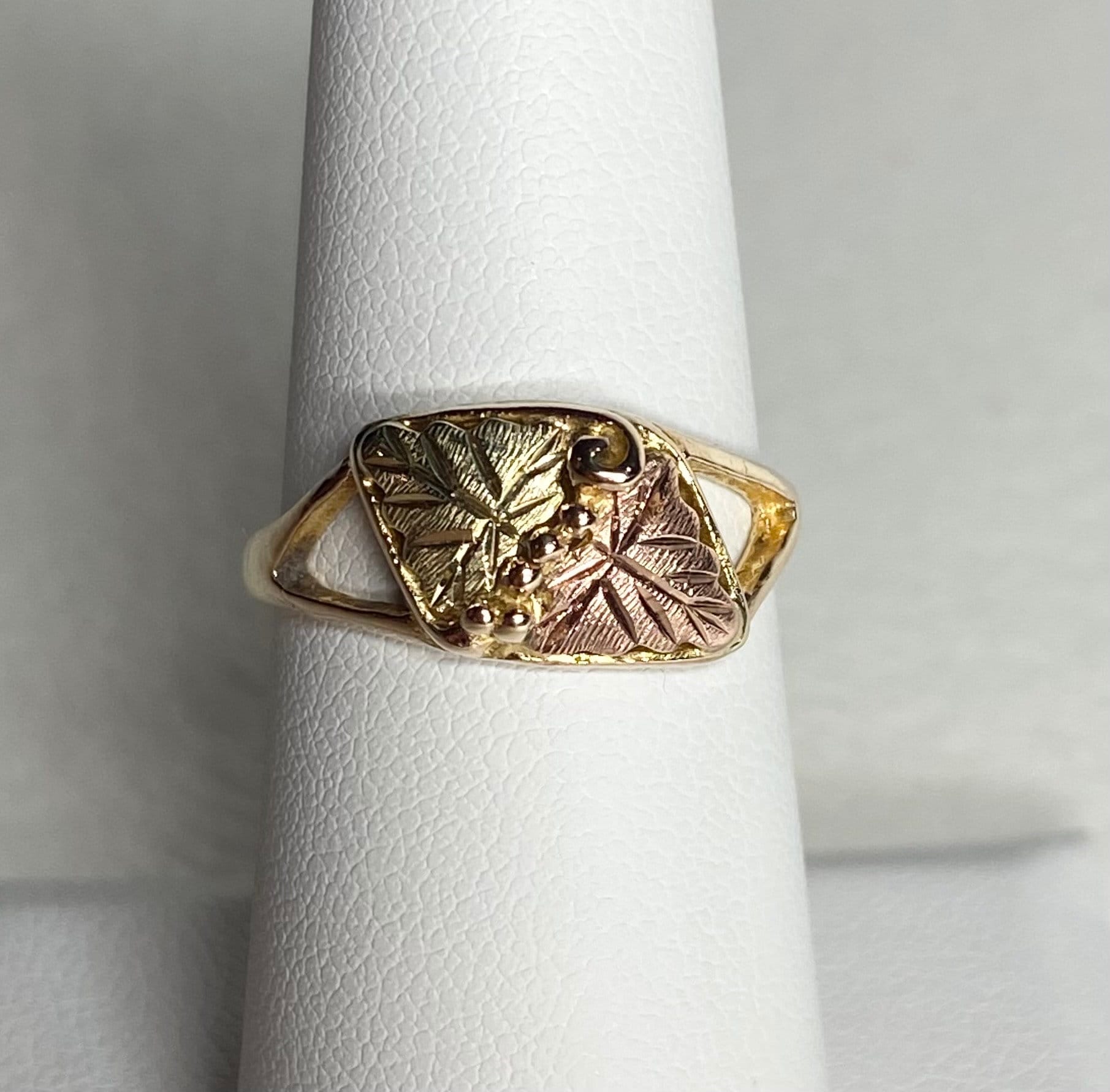 Black Hills Gold ring with two leaves and grapes in 10k gold.