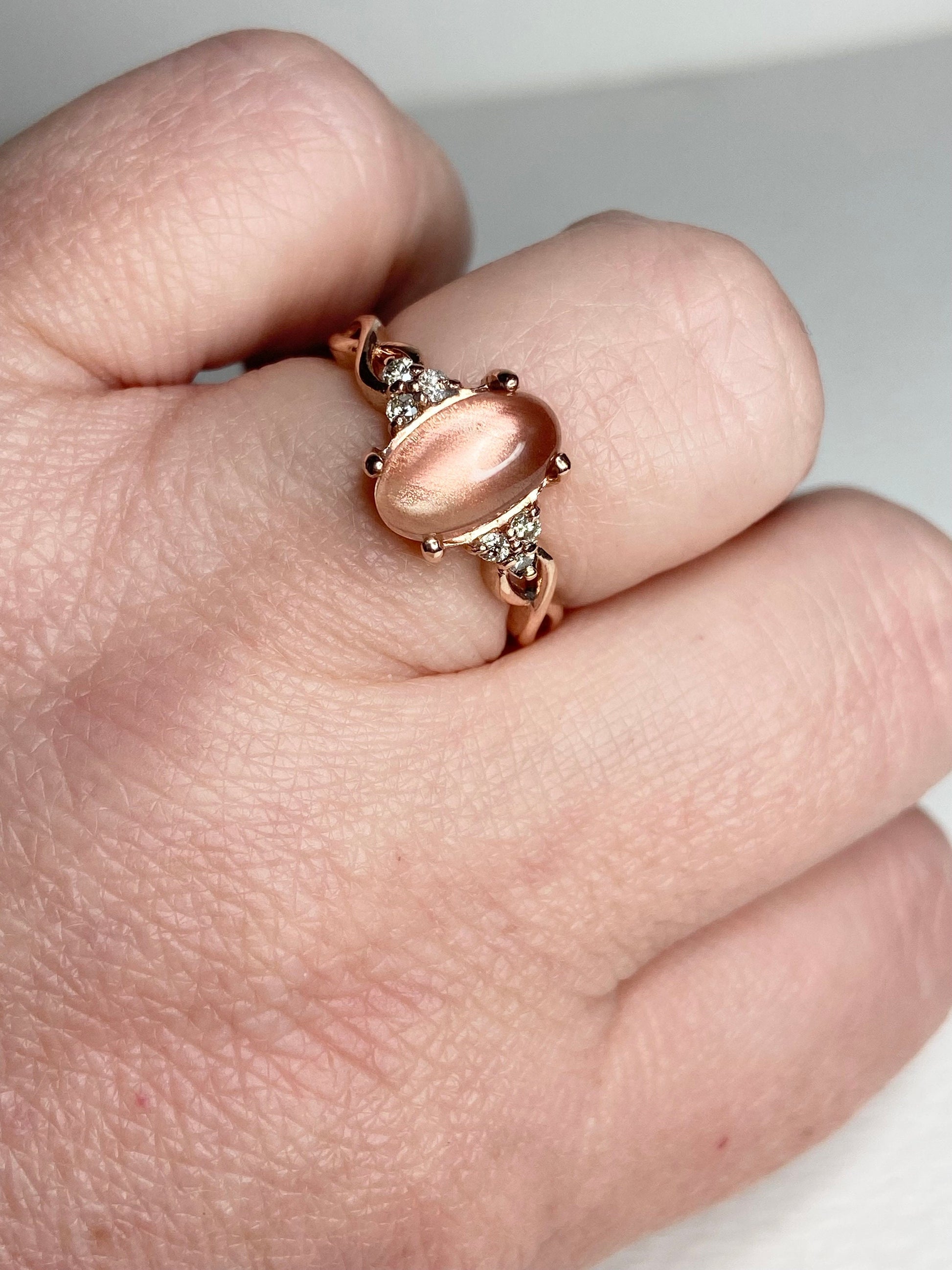 Oregon Sunstone and diamond ring in solid 10k rose gold.