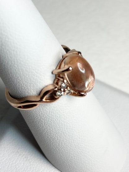 Oregon sunstone and diamond ring in solid 10k rose gold.
