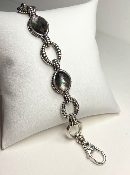 Lagos sterling silver bracelet with Tahitian black lipped oyster mother of pearl and quartz doublet.