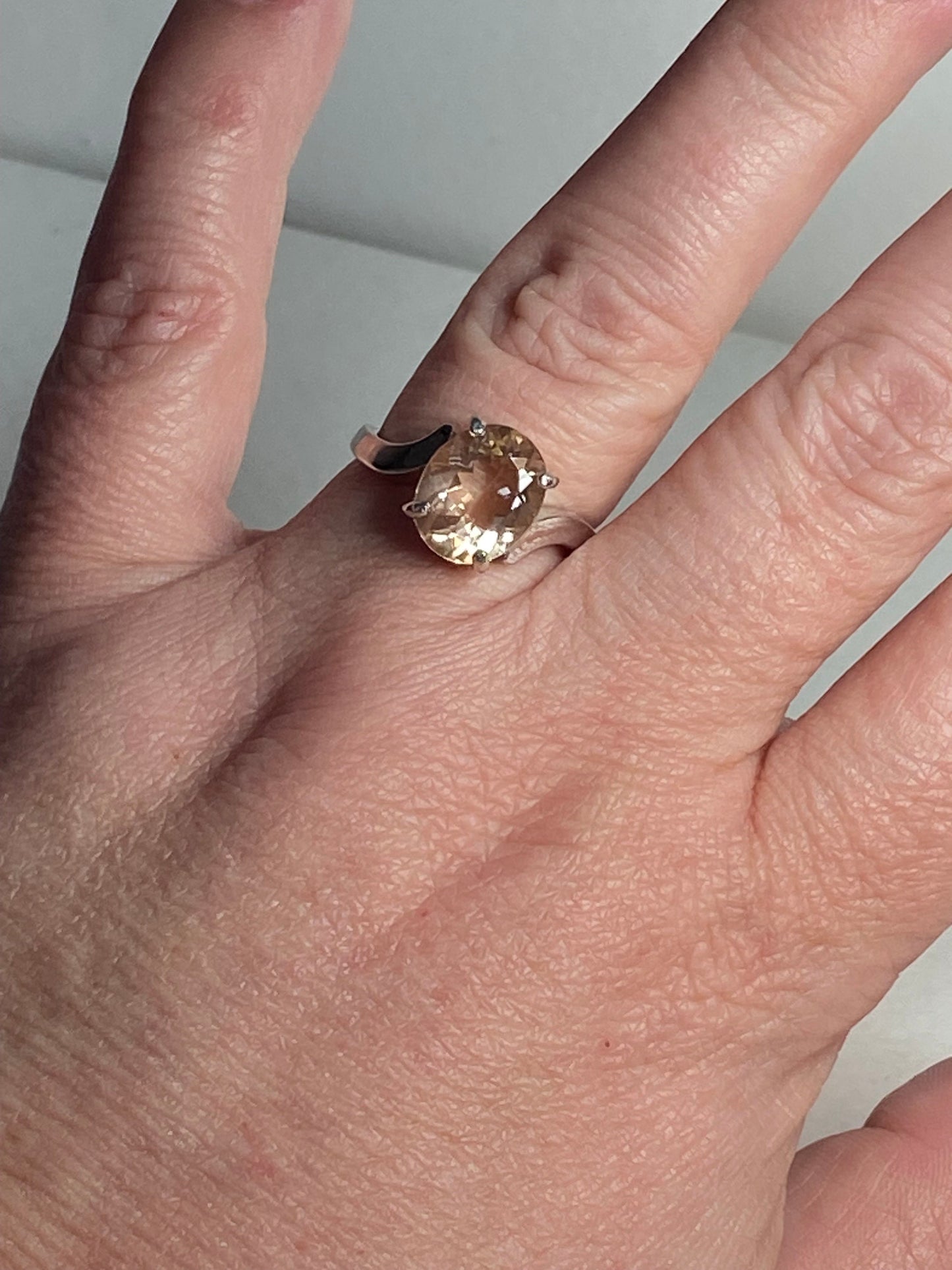 Oval champagne colored Oregon sunstone ring in sterling silver.