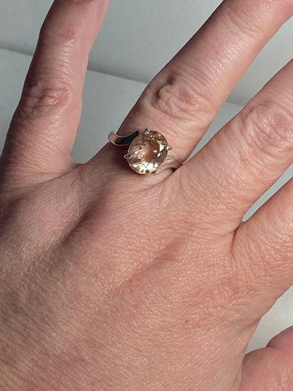 Oval champagne colored Oregon sunstone ring in sterling silver.
