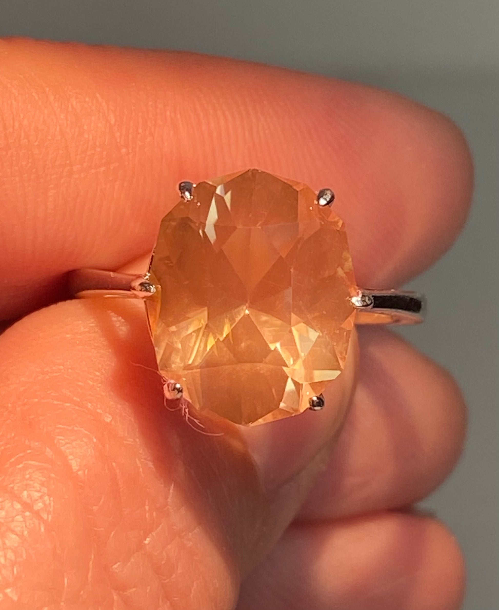 Oval fancy cut Oregon sunstone ring in sterling silver.