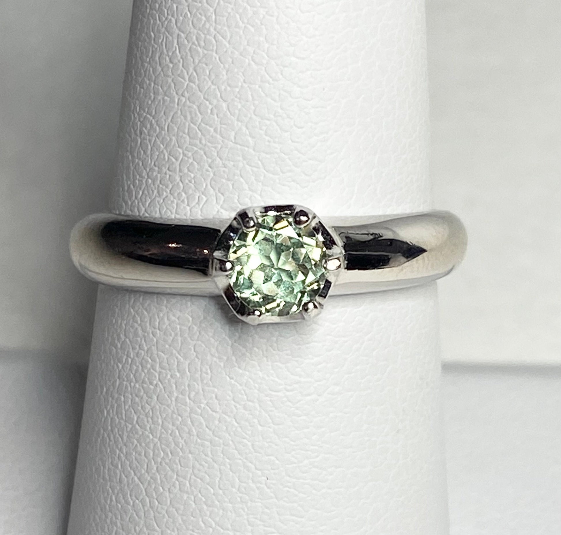 Sterling silver ring with a color-changing chrysoberyl gemstone in a solitaire setting.