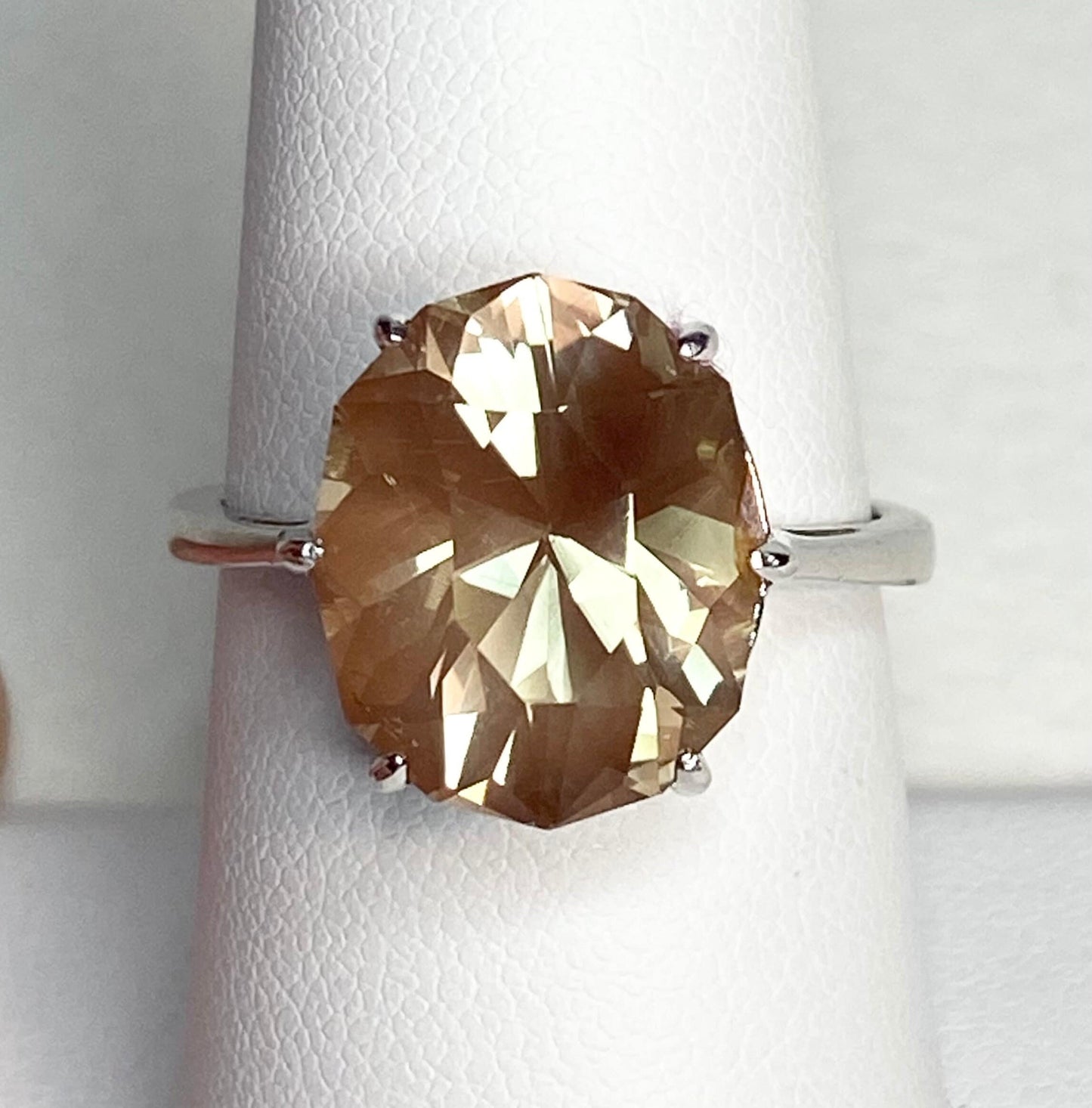 Oval fancy cut Oregon sunstone ring in sterling silver.