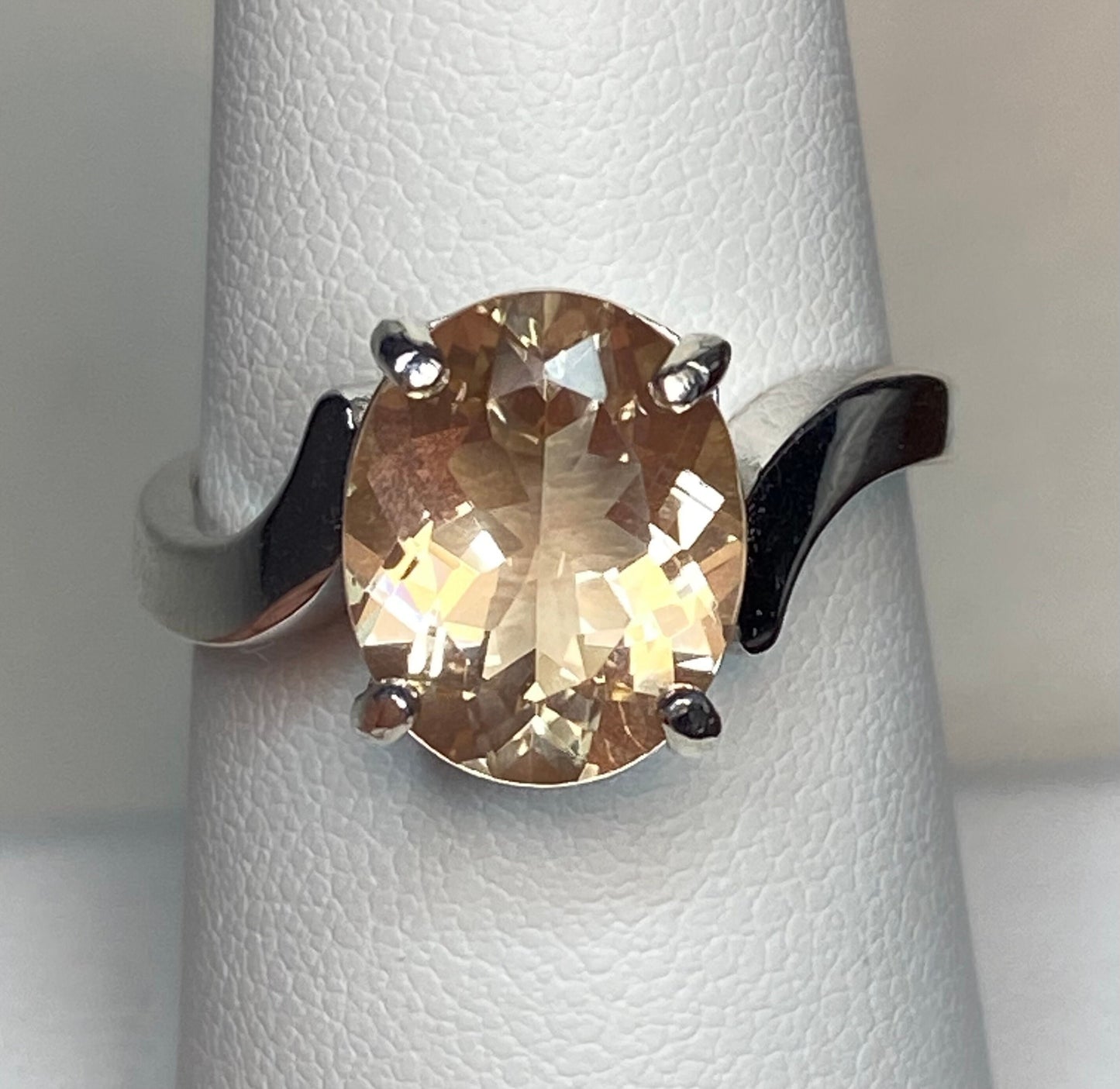 Oval champagne colored Oregon sunstone ring in sterling silver.