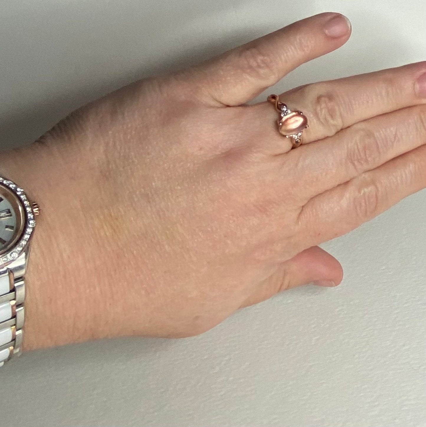 Oregon sunstone and diamond ring in 10k rose gold.