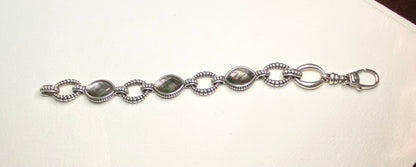 Lagos sterling silver bracelet with Tahitian black lipped oyster mother of pearl and quartz doublet.