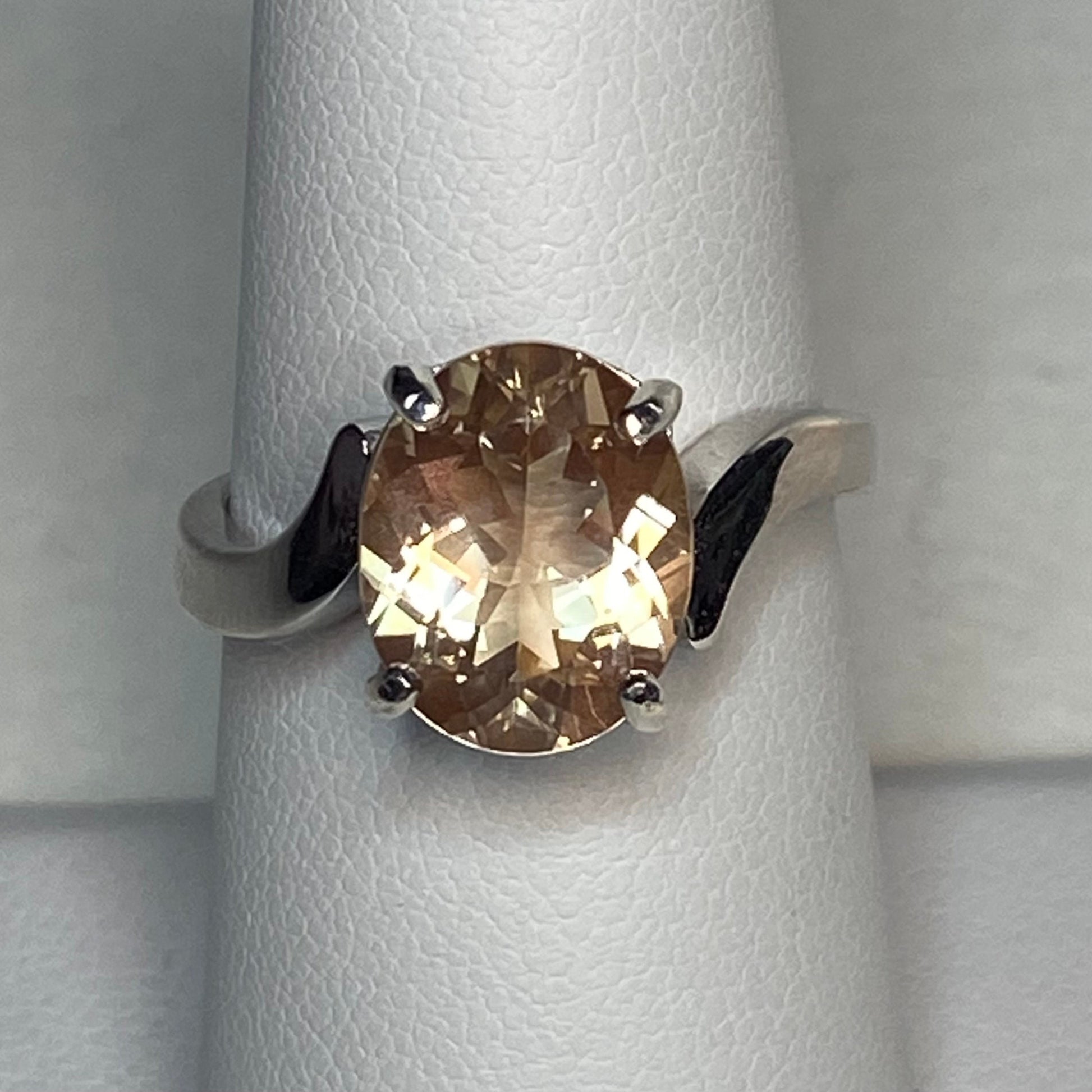 Oval champagne Oregon sunstone ring in sterling silver.