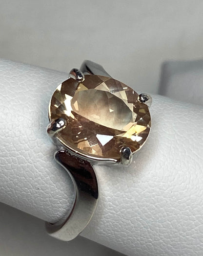 Oval light champagne Oregon sunstone ring in sterling silver.