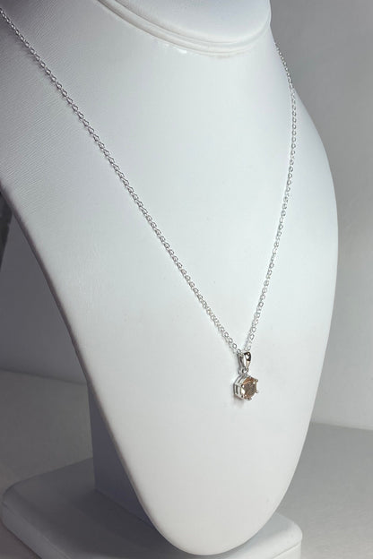 Sterling silver necklace with a round, 7mm, 1.51ct Oregon sunstone pendant.