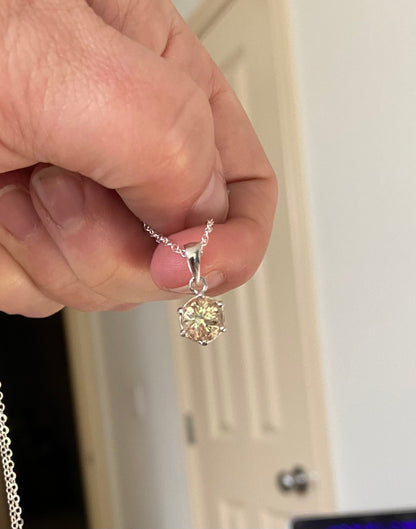 A round, 7mm, 1.51ct Oregon sunstone pendant necklace in sterling silver.