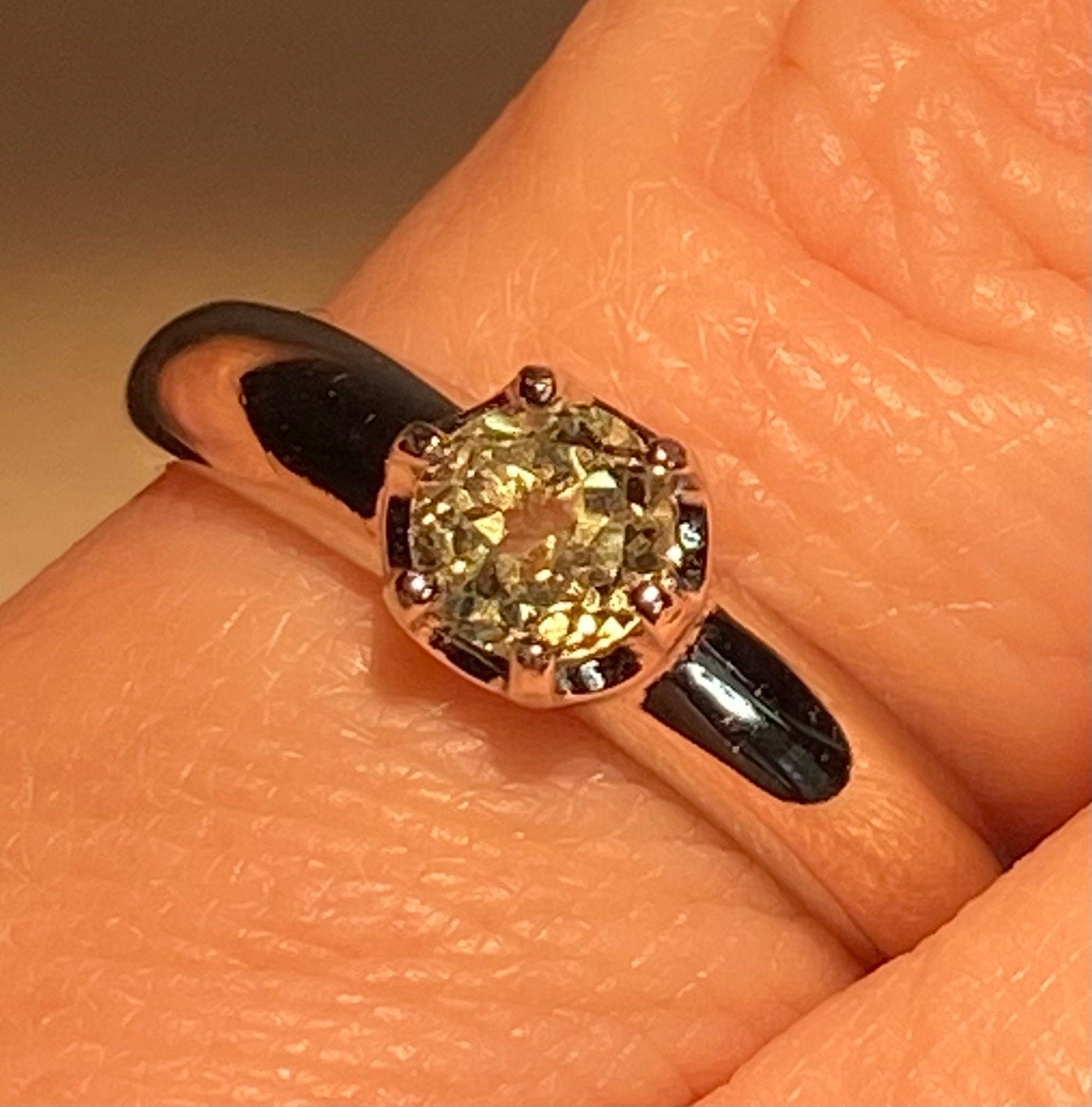 Color change chrysoberyl ring in sterling silver solitaire setting.