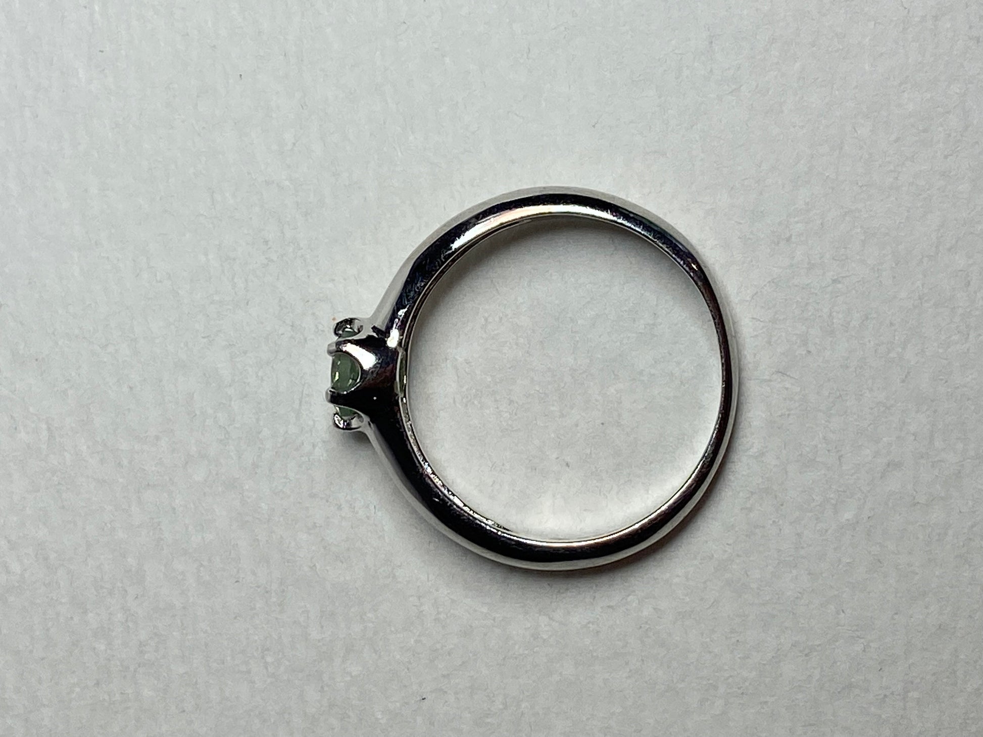 Sterling silver ring with a color-changing chrysoberyl solitaire.