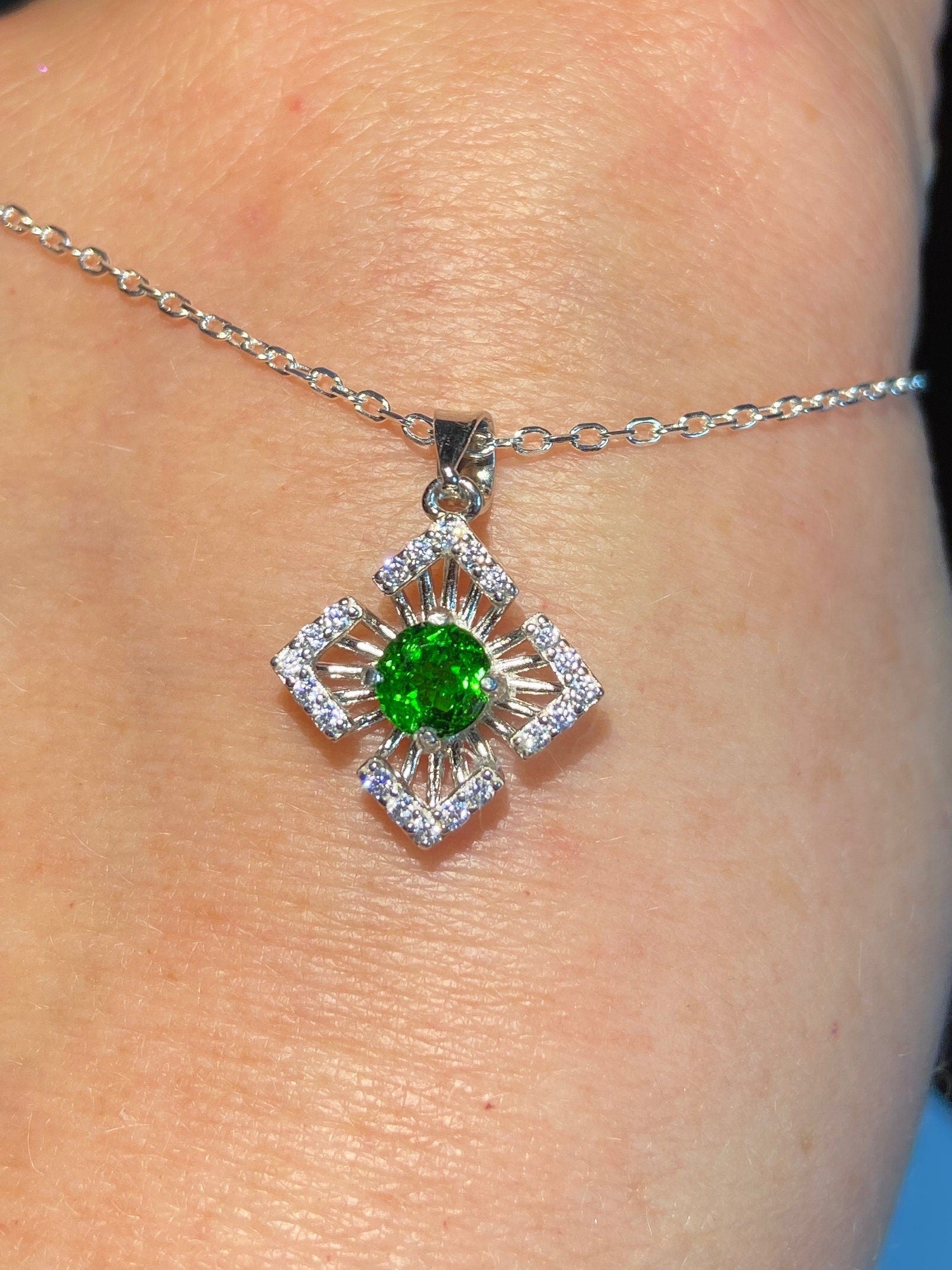 Sterling silver pendant necklace with a green chrome diopside and cubic zirconia accents.