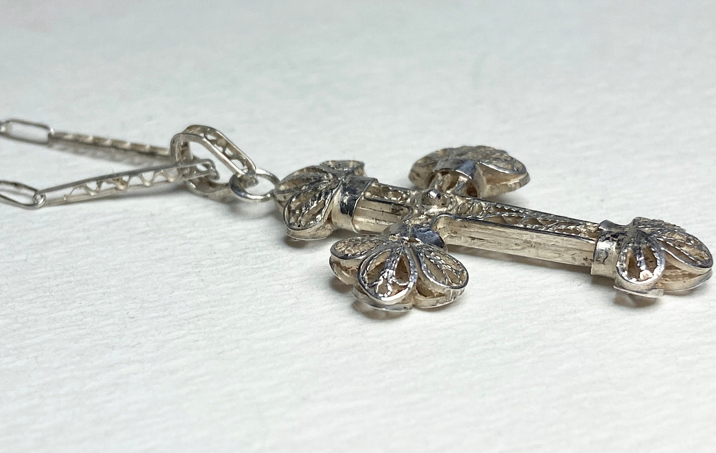 Antique handmade sterling silver filigree cross pendant with chain.
