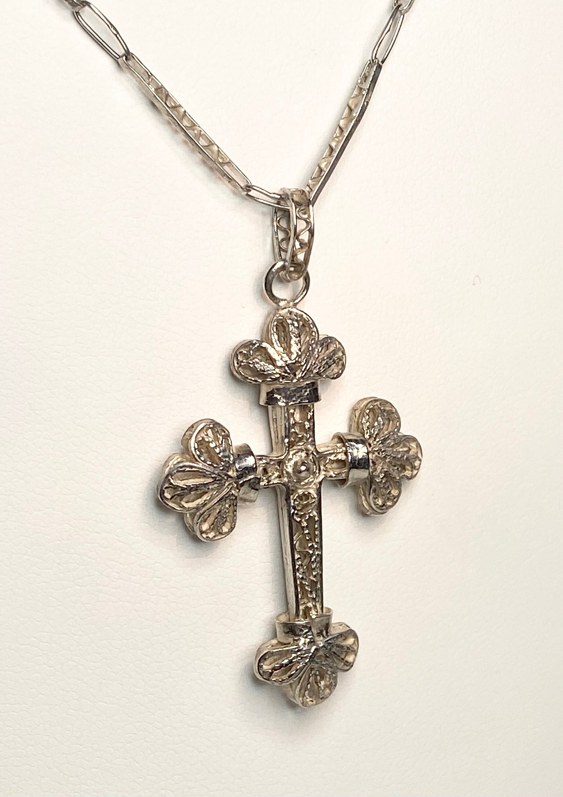 Antique filigree sterling silver cross pendant with a matching chain.