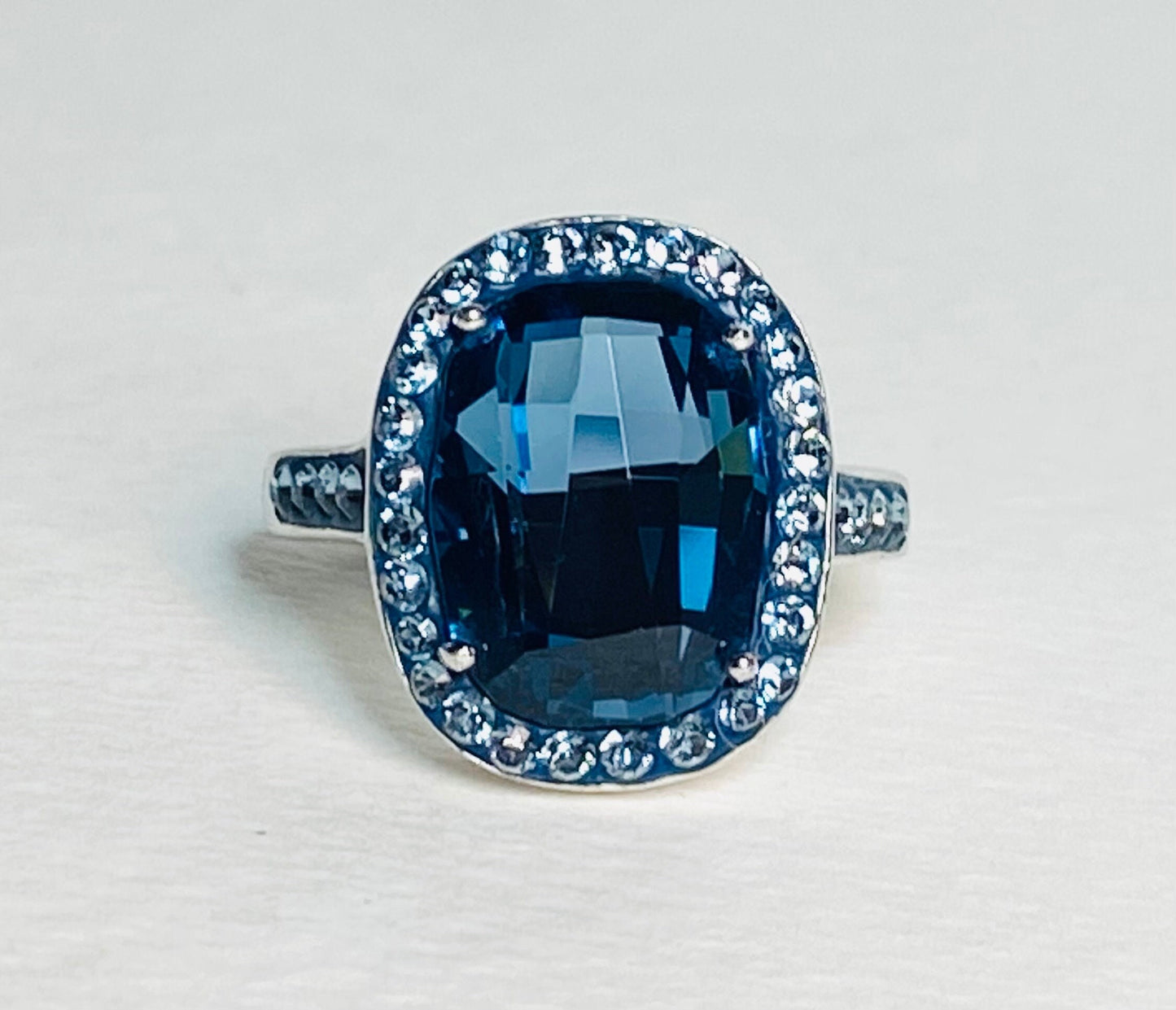 Sterling silver ring with a large Montana blue Swarovski crystal surrounded by smaller crystals.