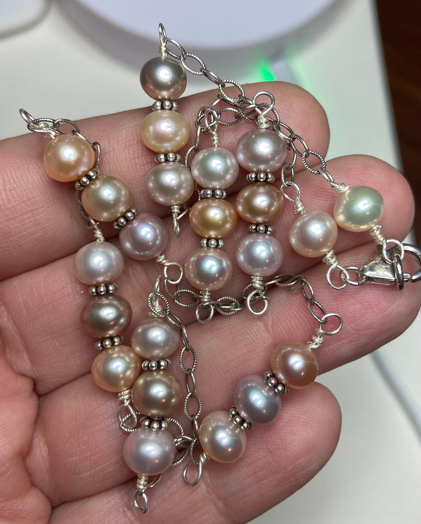 Freshwater multi color natural cultured pearl adjustable station necklace in solid sterling silver.