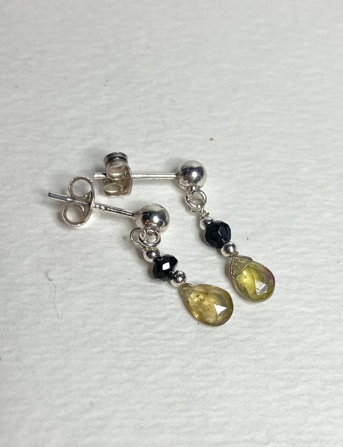 Sterling silver dangle earrings with black and yellow tourmaline beads.