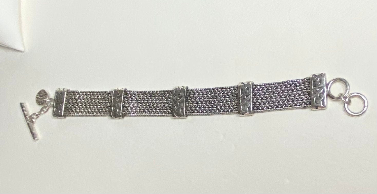 Lois Hill wide woven sterling silver bracelet with toggle clasp.