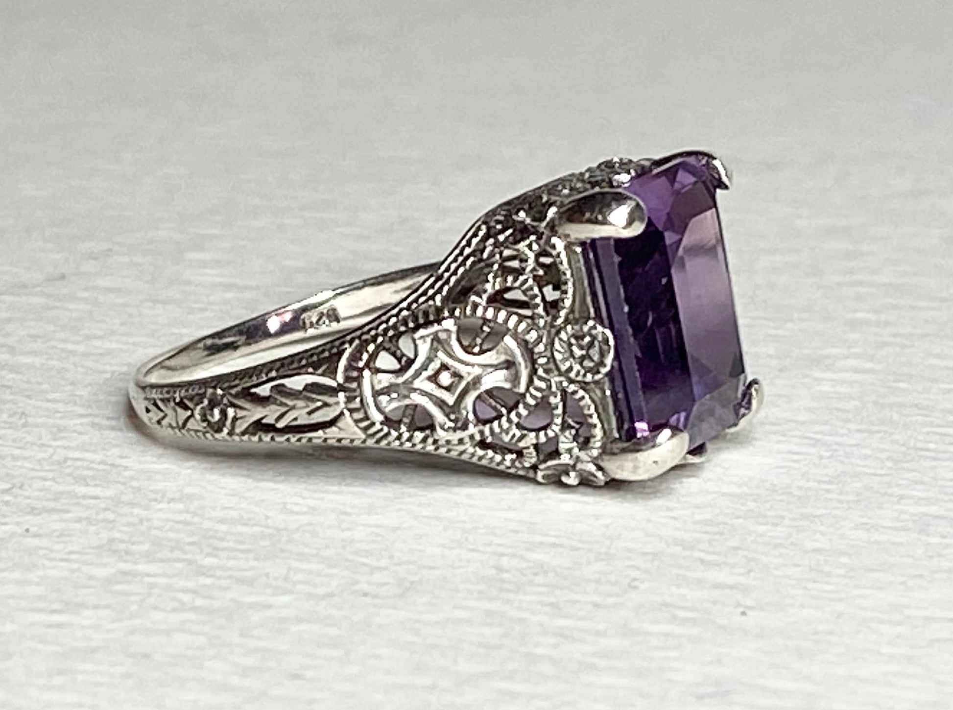 Sterling silver Art Deco ring with a rectangular purple color-change sapphire.
