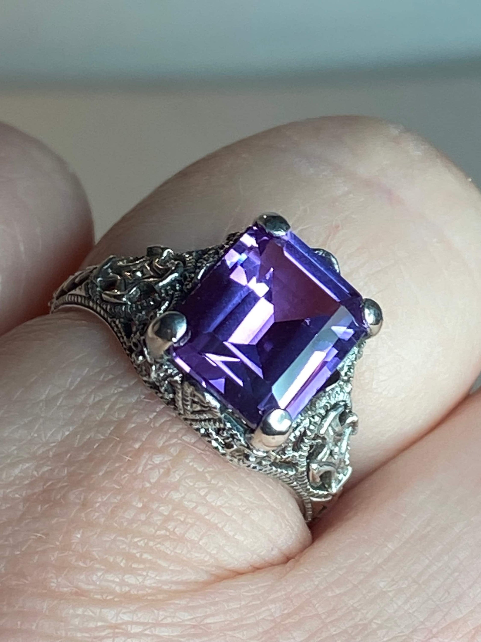 Art Deco sterling silver ring with a square purple color-change sapphire.