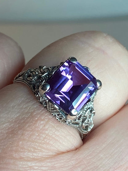 Art Deco sterling silver ring with a square purple color-change sapphire.