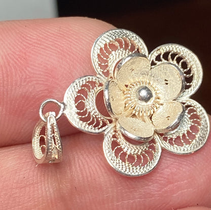 Handmade sterling silver filigree flower pendant.