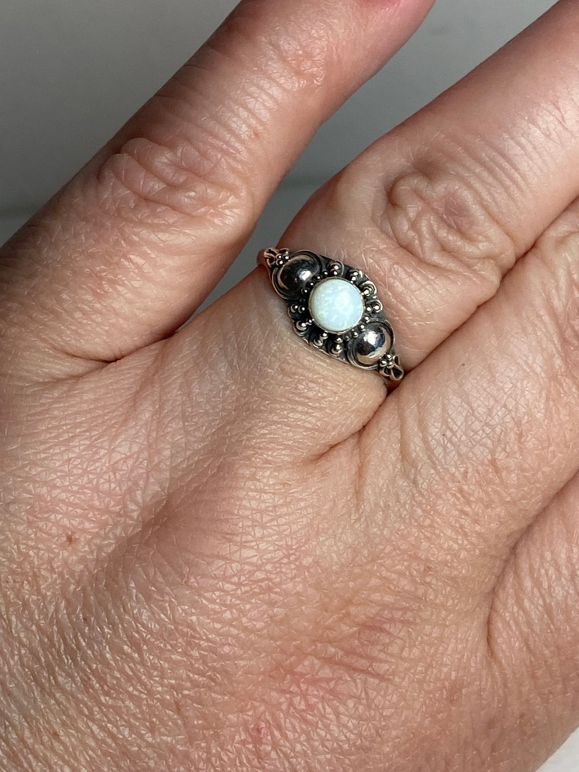 Handmade sterling silver ring with a white Australian opal.