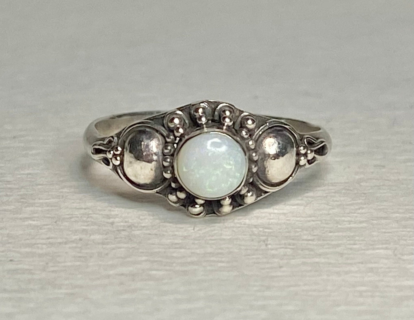 Handmade sterling silver ring with a round Australian opal.