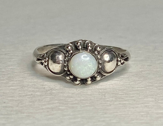 Handmade sterling silver ring with a round Australian opal.
